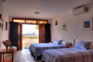 Postel nebo postele na pokoji v ubytování The Isabela Beach House