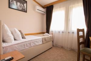 Postel nebo postele na pokoji v ubytování Hotel Yugoslavia