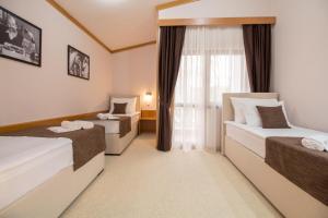 Postel nebo postele na pokoji v ubytování Hotel Yugoslavia