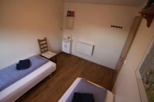 Rúm í herbergi á CJA Guesthouse