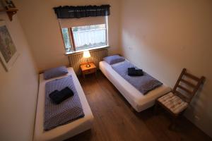 Rúm í herbergi á CJA Guesthouse