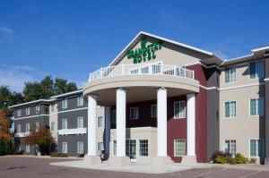 a large apartment building with a balcony at GrandStay Residential Suites Hotel - Eau Claire in Eau Claire