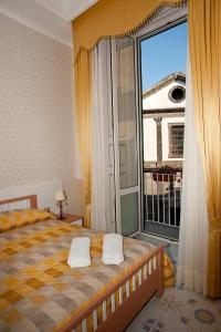 Ένα ή περισσότερα κρεβάτια σε δωμάτιο στο Olimpo degli Dei