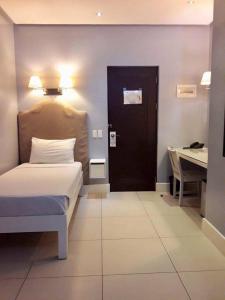 Uma cama ou camas num quarto em Hotel Lorenza