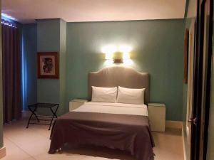 Uma cama ou camas num quarto em Hotel Lorenza