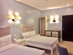 Uma cama ou camas num quarto em Hotel Lorenza