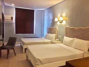Uma cama ou camas num quarto em Hotel Lorenza