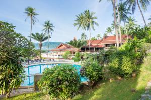 an aerial view of a resort with a swimming pool and palm trees at Nova Samui Resort in Chaweng