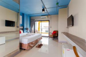 a hospital room with a bed and a tv at Samkwan Village in Bangsaen