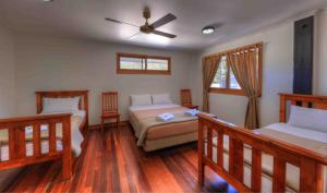 Ένα ή περισσότερα κρεβάτια σε δωμάτιο στο Fraser Island Retreat +22 φωτογραφίες