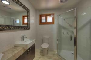 a bathroom with a toilet and a shower and a sink at Fraser Island Retreat in Fraser Island +22 photos