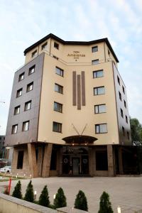 a tall building with at Ambiance Hotel in Bucharest