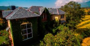 an aerial view of a house with ivy on it at Seclude Palampur in Pālampur
