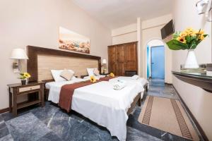 Postel nebo postele na pokoji v ubytování Potamaki Beach Hotel