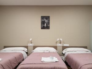Postel nebo postele na pokoji v ubytování Albergue Camiño Real