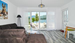 a living room with a couch and a table at Apartments Edera in Tivat