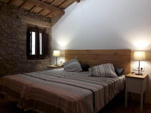 Llit o llits en una habitació de Mas Roca Del Mill