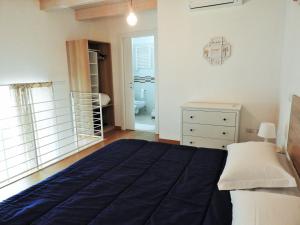 Postel nebo postele na pokoji v ubytování Arco Della Neve Guest House