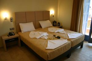 Ein Bett oder Betten in einem Zimmer der Unterkunft Sirena Residence & Spa