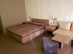 A bed or beds in a room at Spa Hotel Ata