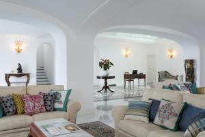 a living room with two couches and a table at Anna Belle Elegant AgriResort in Sorrento