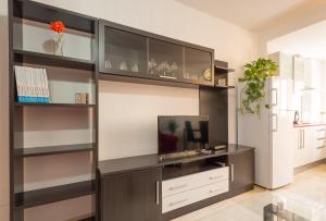Telewizja i/lub zestaw kina domowego w obiekcie Apartamento Ventura Rodriguez 39