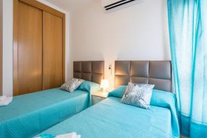 Łóżko lub łóżka w pokoju w obiekcie Apartamento Ventura Rodriguez 39
