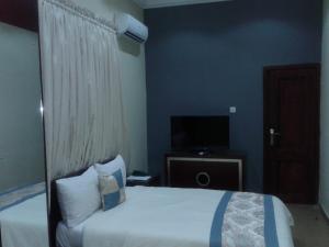 Voodi või voodid majutusasutuse Conference Hotel & Suites Ijebu toas