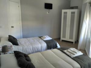 Postel nebo postele na pokoji v ubytování Guesthouse Central