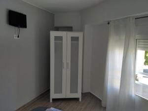 TV a/nebo společenská místnost v ubytování Guesthouse Central