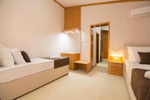 Postel nebo postele na pokoji v ubytování Hotel Yugoslavia