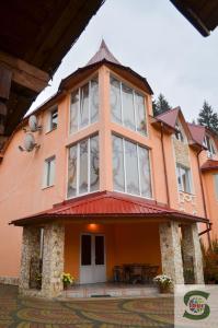 a house with a large window on top of it at U Kvasu Hotel in Kelechin