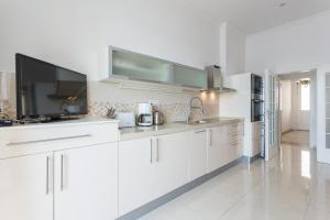 Kuchyň nebo kuchyňský kout v ubytování Apartments Villa Victoria