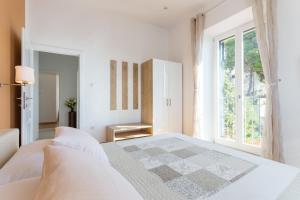 Postel nebo postele na pokoji v ubytování Apartments Villa Victoria