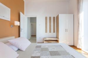 Postel nebo postele na pokoji v ubytování Apartments Villa Victoria