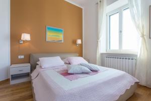 Postel nebo postele na pokoji v ubytování Apartments Villa Victoria 2
