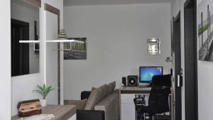 TV a/nebo společenská místnost v ubytování Apartma Auriga