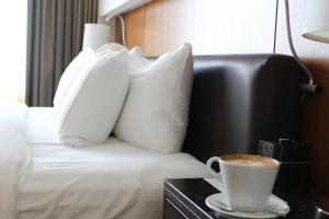 Postel nebo postele na pokoji v ubytování Hotel Arista