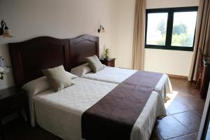 Кровать или кровати в номере Arcos de Montemar