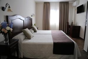 Кровать или кровати в номере Arcos de Montemar