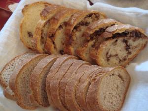 three loaves of bread sitting on top of a napkin at B&B Maison Angélus in Saint Malo