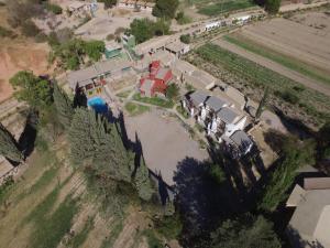 an aerial view of a house with a river at El Refugio de Coquena in Purmamarca +58 photos