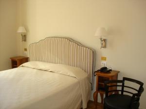 Postel nebo postele na pokoji v ubytování Hotel Certosa