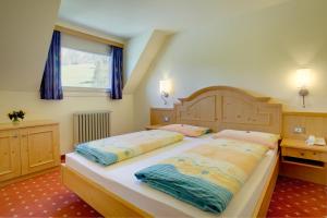 Кровать или кровати в номере Hotel Castel Latemar