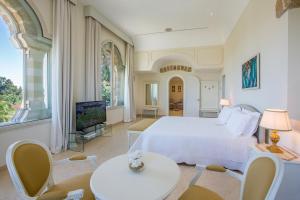 TV a/nebo společenská místnost v ubytování Sangiorgio Resort & Spa