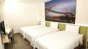 Postel nebo postele na pokoji v ubytování CU Hotel Taipei
