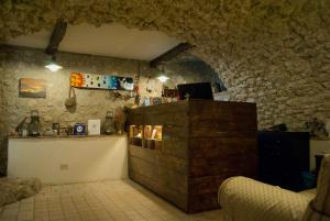 a kitchen with a wooden cabinet in a room at Residenza La Torre in Santo Stefano di Sessanio