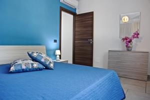 Cama o camas de una habitación en Le Ville del Capo - by Vacation Service