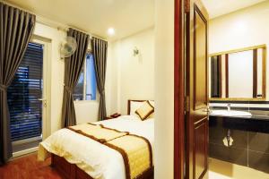 Giường trong phòng chung tại Thanh Thanh Hotel