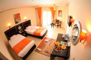 Posteľ alebo postele v izbe v ubytovaní Sphinx Aqua Park Beach Resort